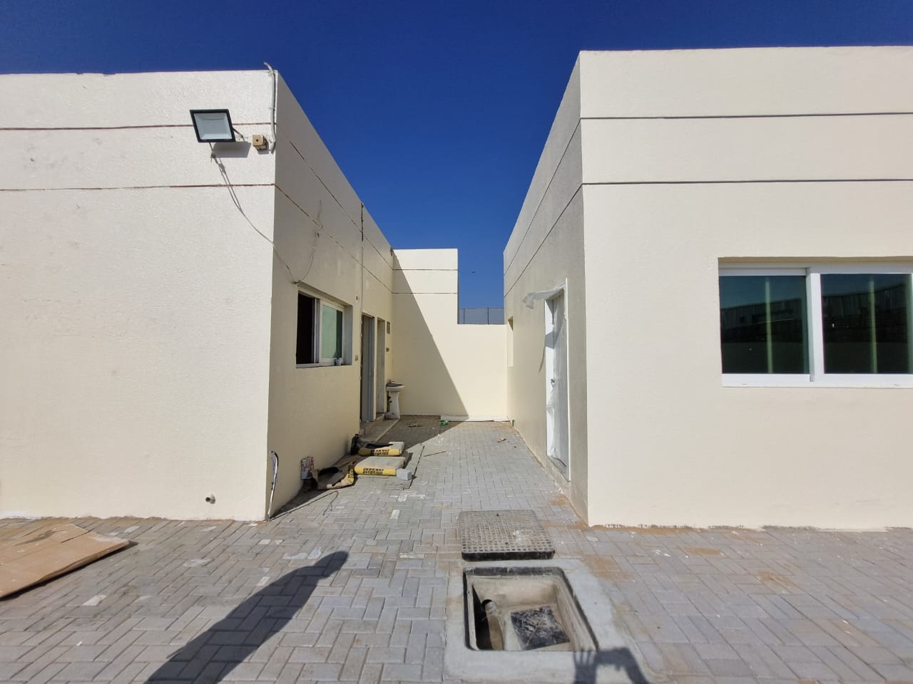 7000 SQRFT YARD READY POSITION AVAILABLE FOR RENT 2 ROOMS 1 OFFICE BOUNDRY WITH ELECTRICITY WATER AND CIVIL DIFENCE INTERLOCK NEAT CLEAN ON MAIN ROAD
