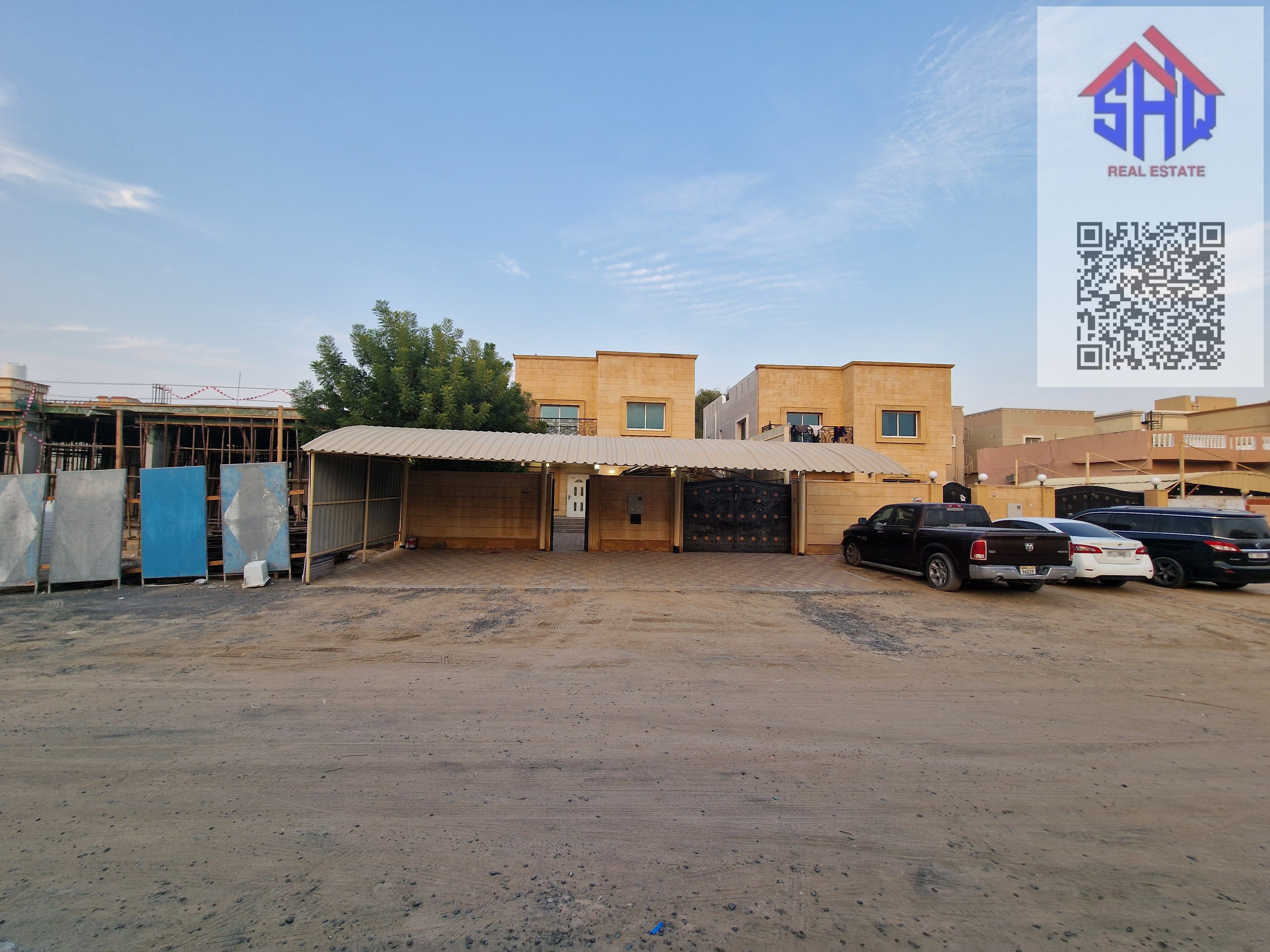 Villa for sale in Al Muwaihat area, next to a mosque and opposite an amusement park. Includes water, electricity, and air conditioning. 4 bedrooms, living room, and storage room.