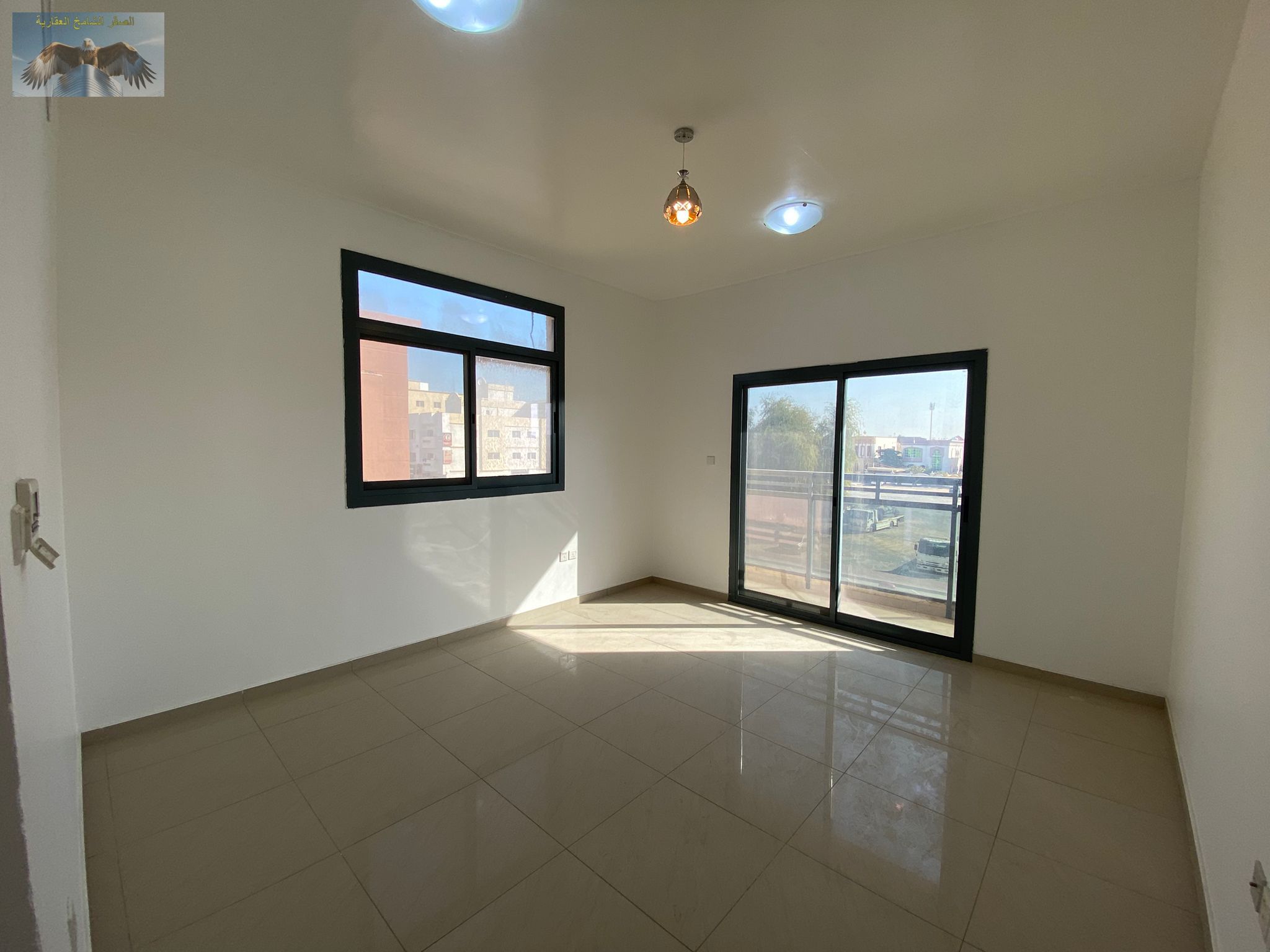 Luxurious apartment with two bedrooms and a living room in a prime location in Al Rawda 3, featuring 3 bathrooms, a balcony, spacious areas, modern de