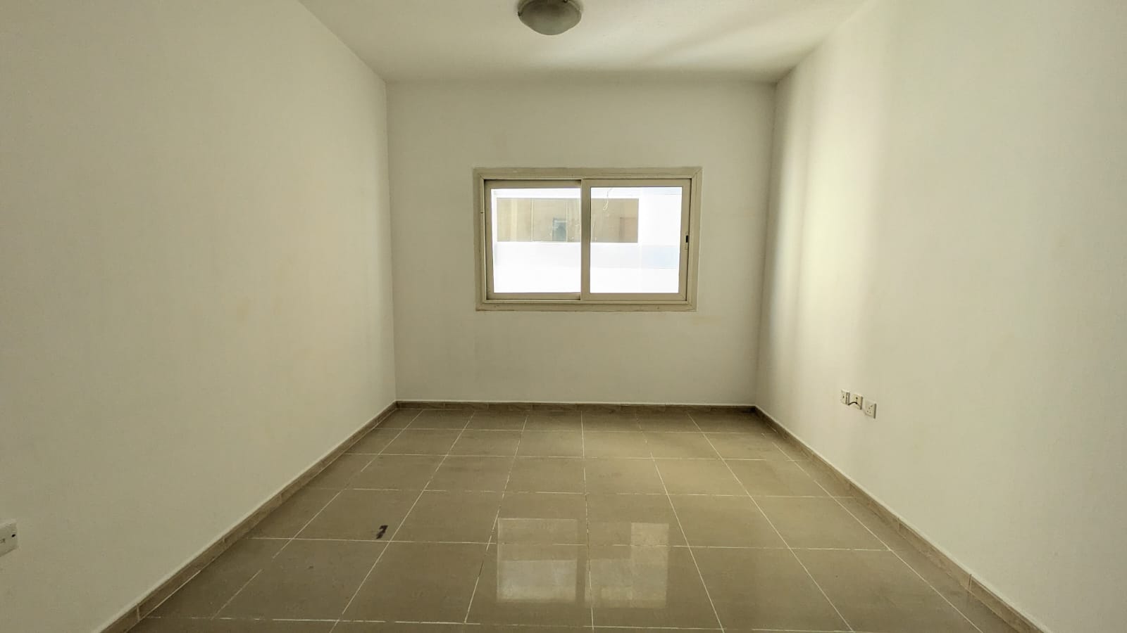Spacious living with open view good finishing gym and maintenance free good location near close exit to dubai