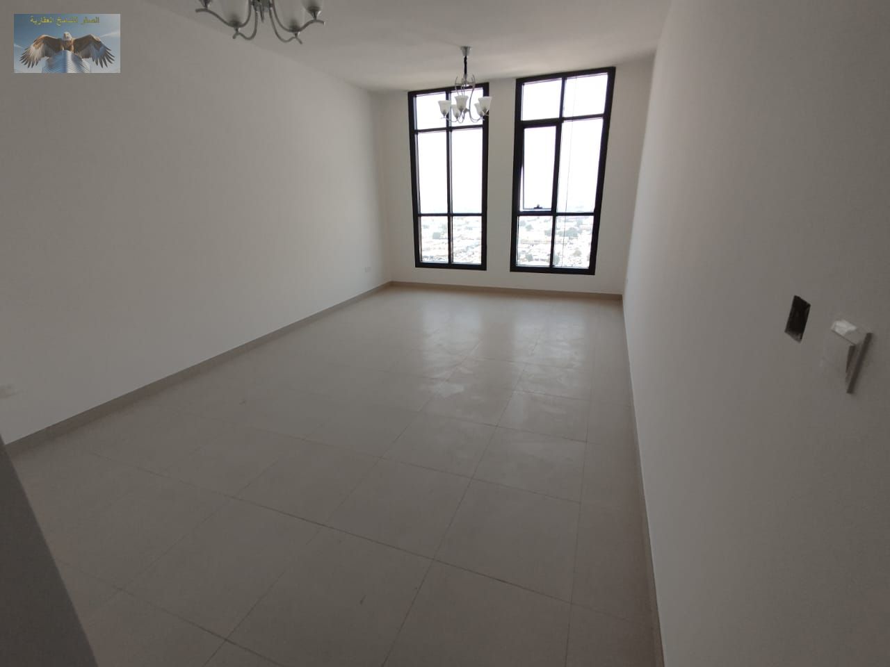 2-bedroom apartment with a spacious living room, 2 bathrooms with built-in wardrobes, private parking, and a prime location close to services and mall
