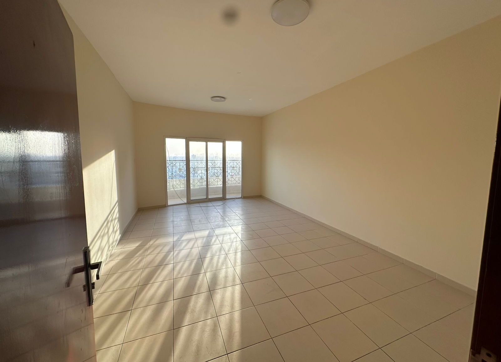 Available for annual rent in Ajman: Two bedrooms and a separate living room with a balcony. Strategic location. Flexible payment plans available.