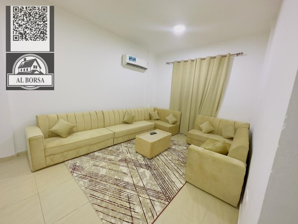 Furnished apartment for rent in Al Muwaihat 3 - Ajman, one bedroom + living room, central air conditioning, clean furnishings, ready to move in imm