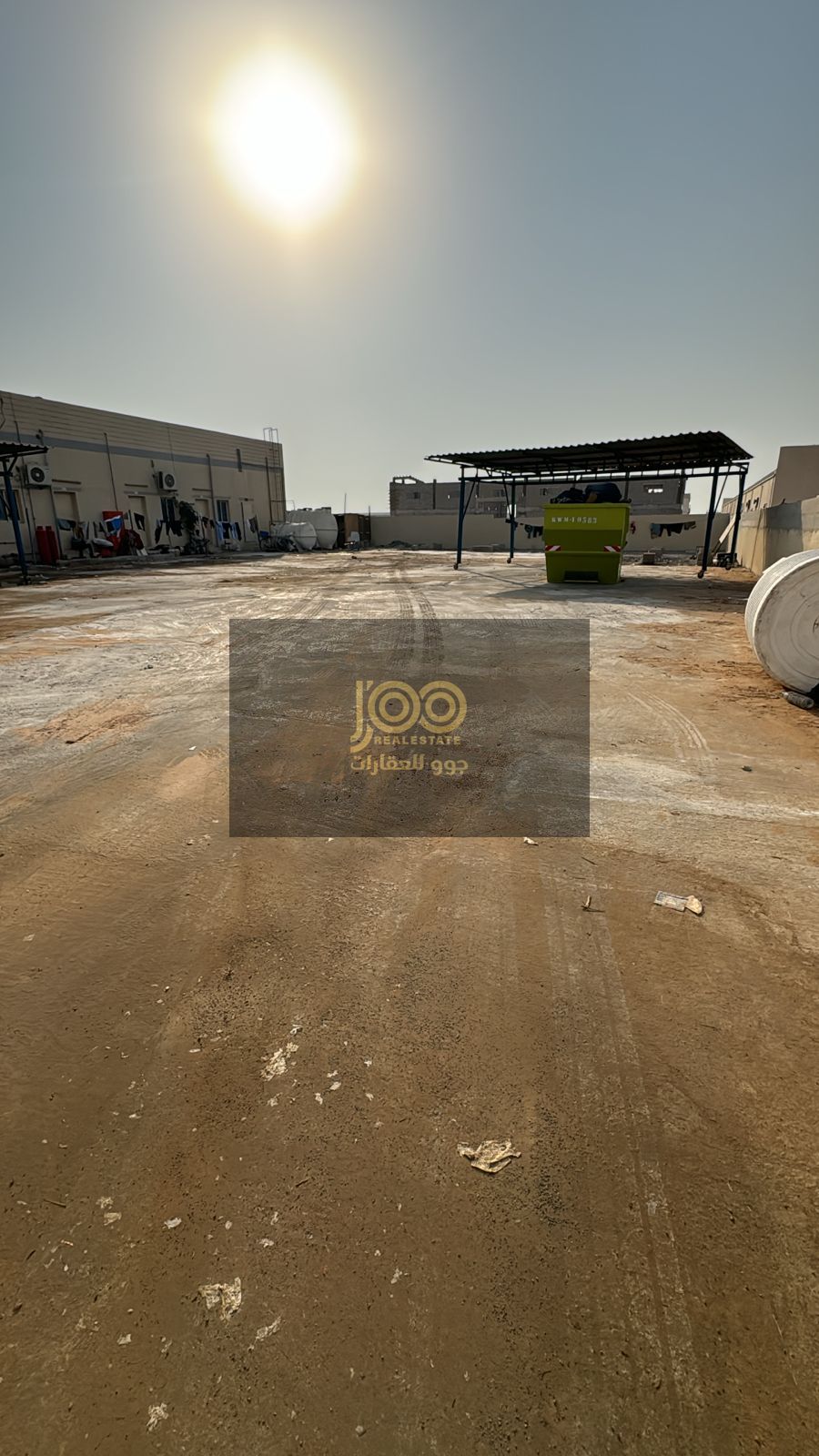 A plot of land is available for rent in Umm Al Quwain, Umm Al Thu'ub area, suitable for various commercial or storage activities.