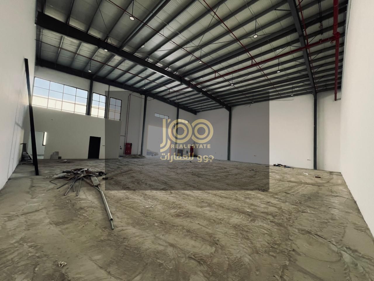 A prime warehouse for rent in Umm Al Thu'ub, suitable for all types of storage and industrial/commercial activities.