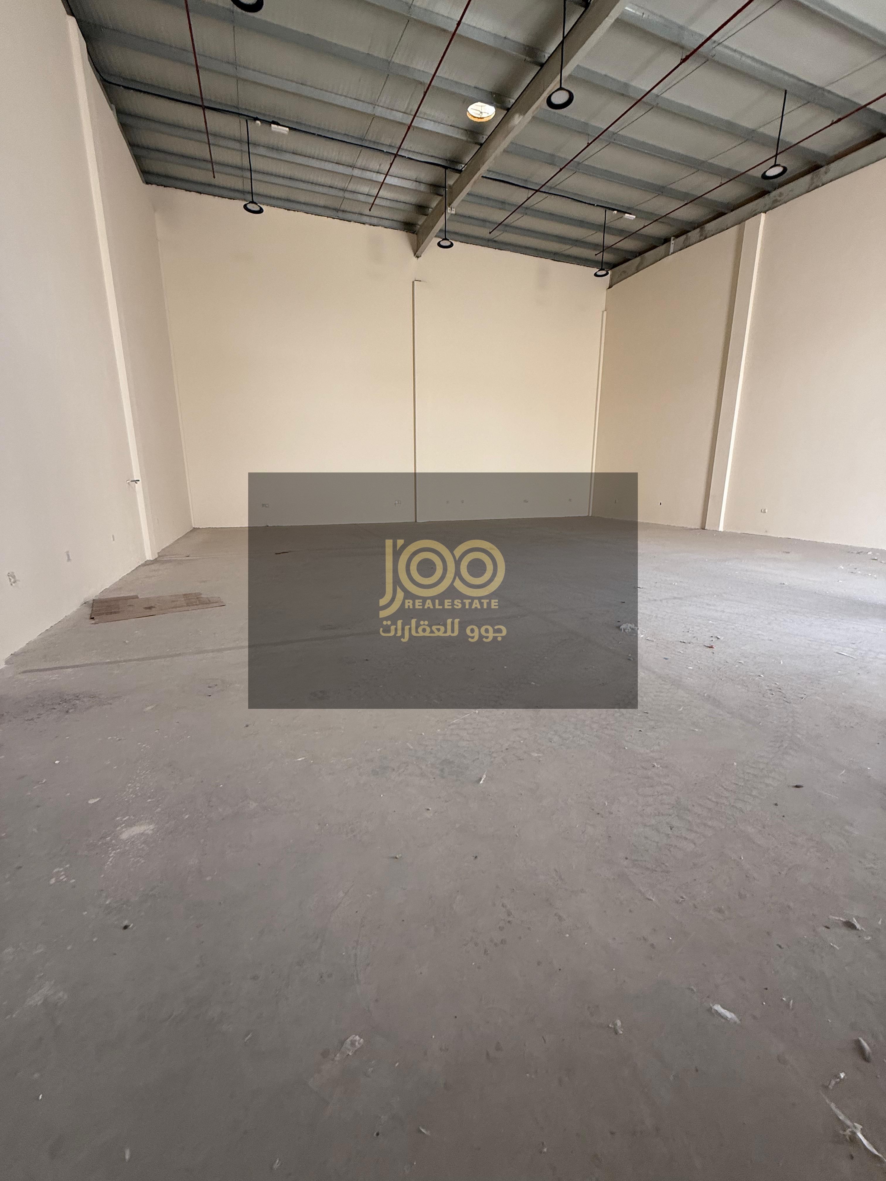 Two adjacent warehouses for rent in Umm Al Thu'ub, offering practical storage space that helps organize business and provides ample room.