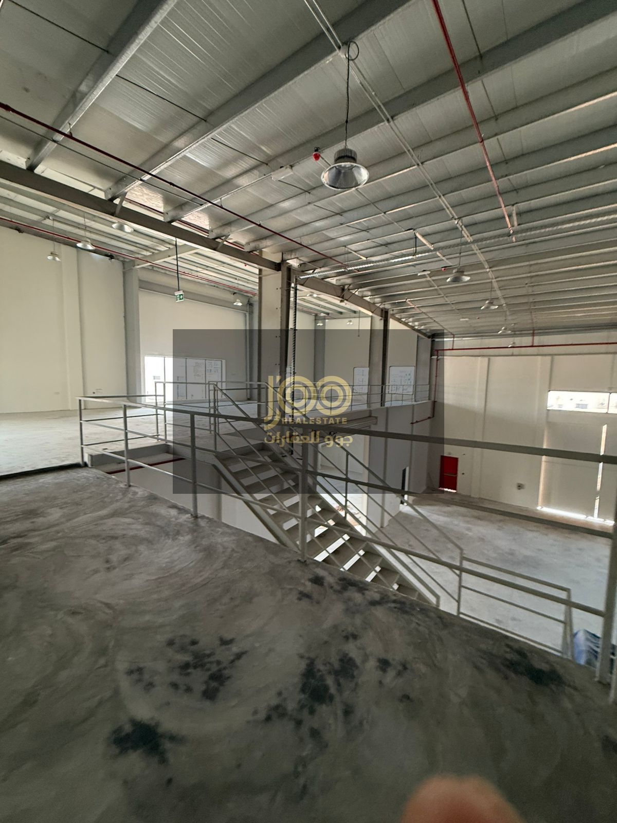 A mezzanine warehouse is available for rent in the Umm Al Quwain Industrial Area. The warehouse is suitable for various activities.