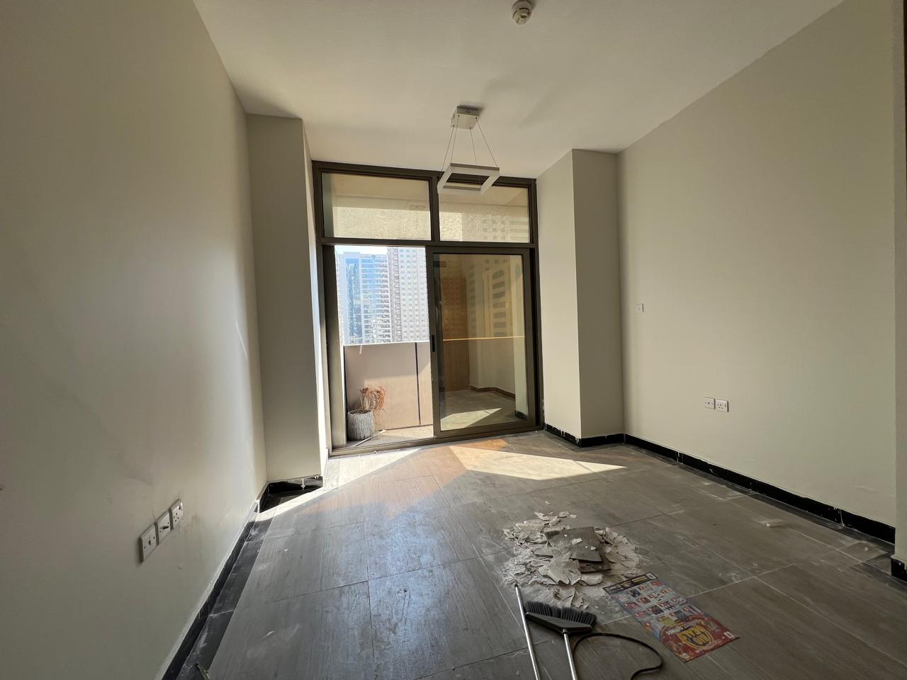 Three-bedroom apartment with living room, balcony, and parking in Al Taawun Al Mamzar, first tenant after maintenance, super deluxe finishing, open vi
