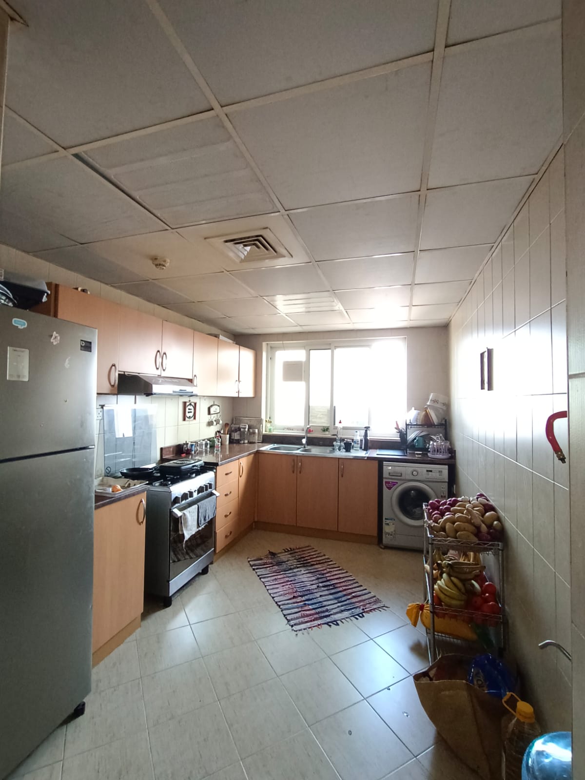 A premium apartment for sale in the Emirate of Sharjah — two bedrooms, a living room, a kitchen, and two bathrooms, with a maid’s room. Located in a m