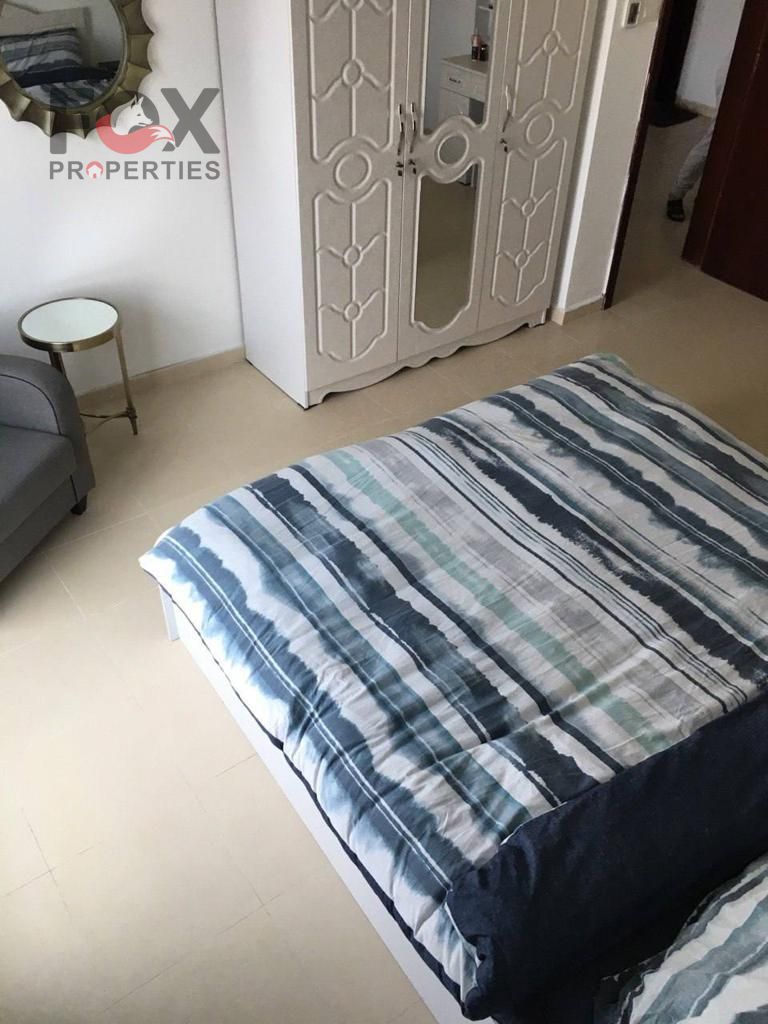 A spacious one-bedroom apartment and living room are available for annual rent in City Tower, offering a completely open view of the palace. It boasts