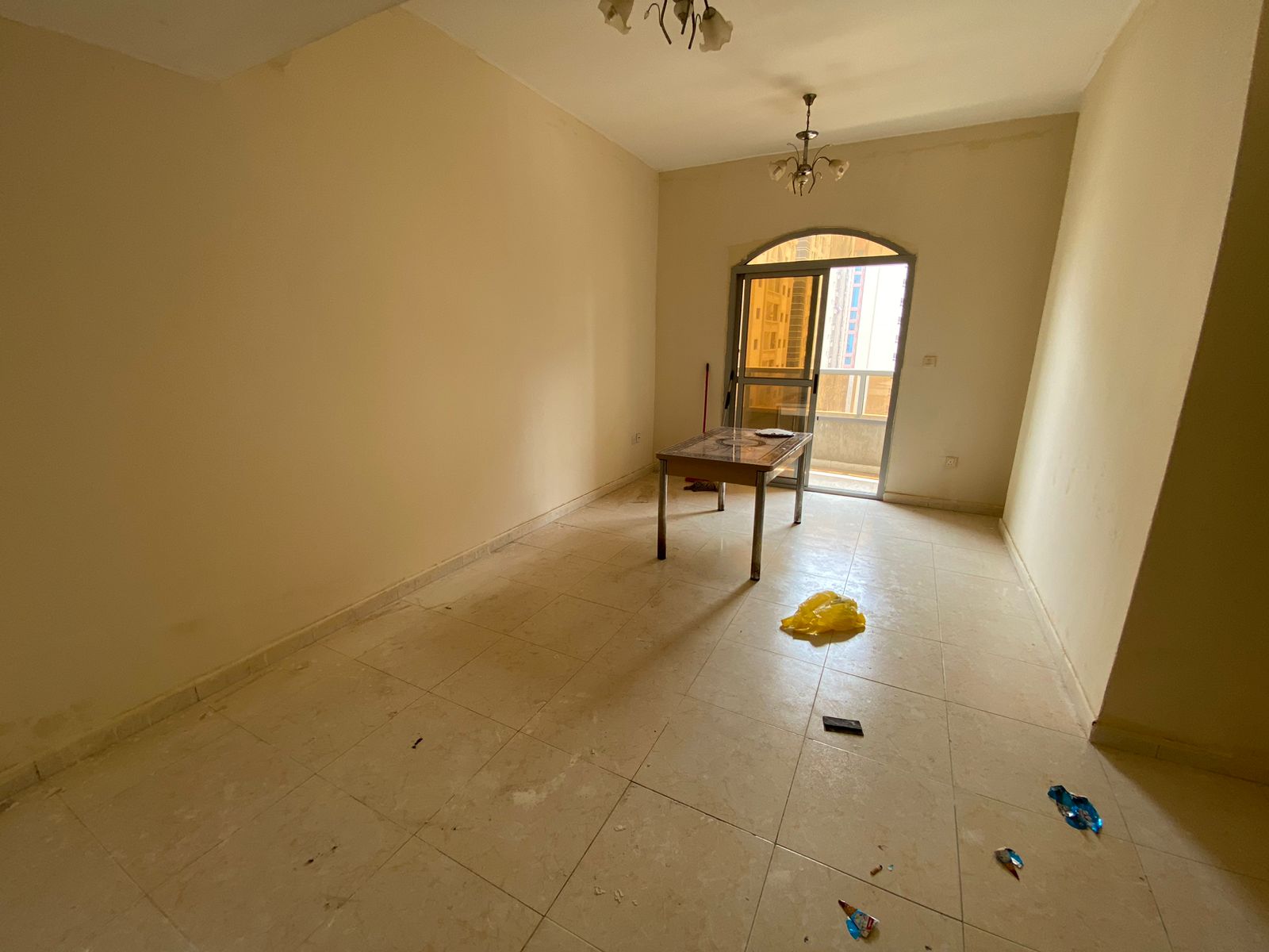 Golden opportunity for annual rent in Ajman: Two bedrooms, a living room, a balcony, and parking inside a tower. Strategic location, close to services
