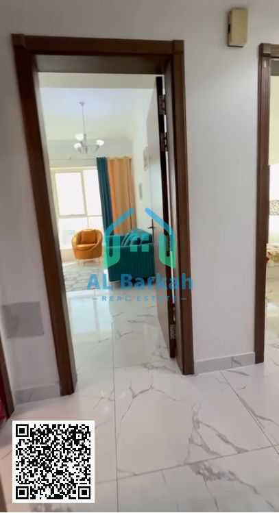 One-bedroom apartment with living room for cash sale in Al Waha Towers, open view, no balcony