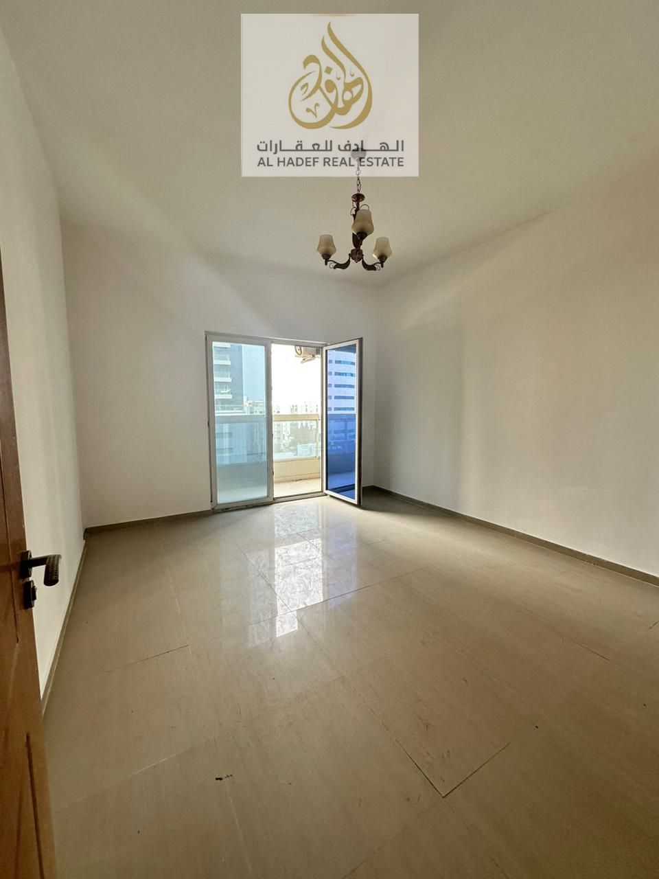 Two-bedroom apartment with a living room for annual rent in Al Nuaimiya 3, directly on Sheikh Khalifa Street.