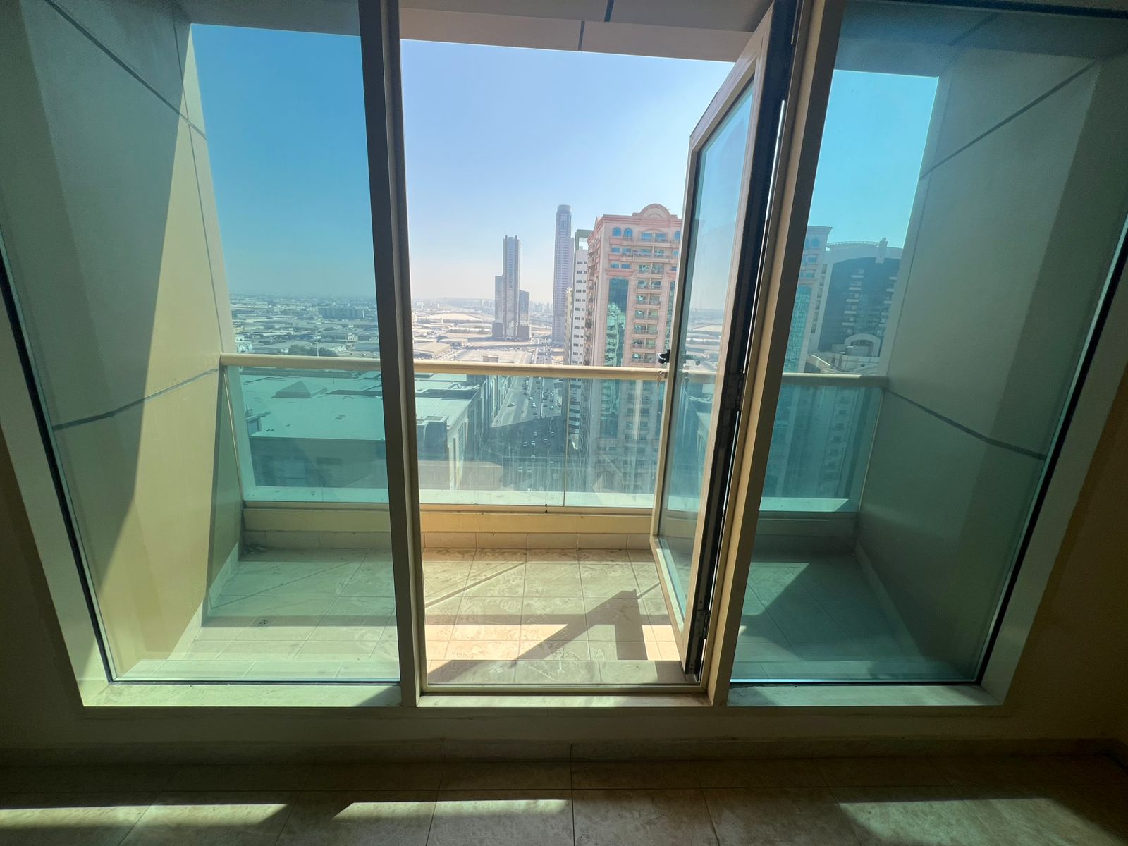 Three-bedroom apartment with living room in Al Taawun, first tenant after maintenance, free AC, balcony, master bedroom, 3 bathrooms, storage room, re