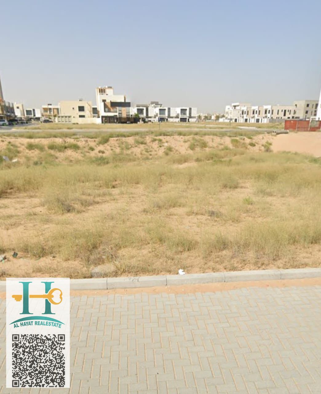 Residential and commercial land in Al Alia, Ajman, directly on Sheikh Mohammed bin Rashid Street (ground floor + 5), freehold for all nationalities