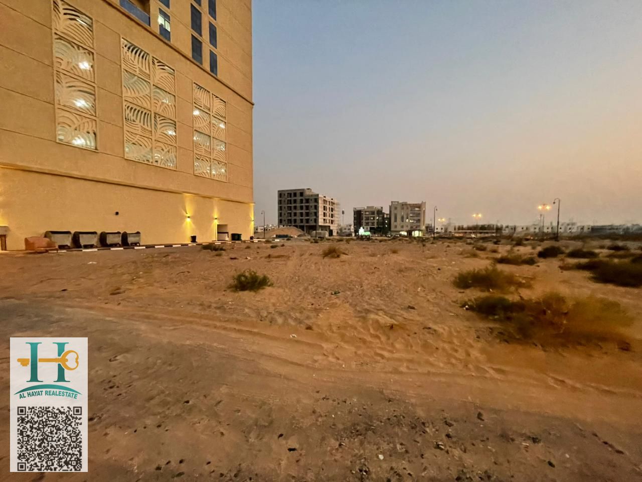 Residential and commercial land (ground floor + 10) in Al Yasmeen, Ajman, behind Princess Village, on an asphalt street, free for all nationalities