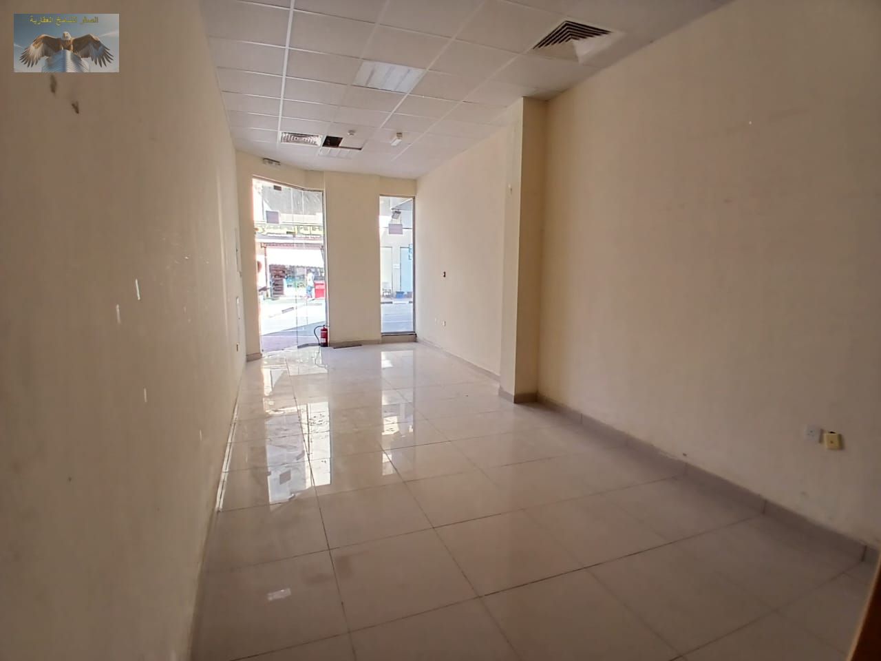 Shop for rent in Al Jurf 2, strategically located with excellent visibility, suitable for various businesses, annual rent AED 22,000 payable in 4 inst