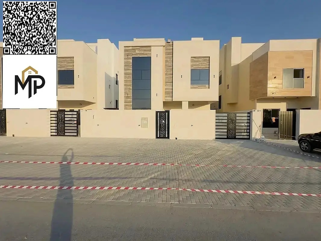 A luxurious two-story villa with a modern design, featuring 7 master bedrooms, an elegant majlis, a spacious lounge, a maid's room, high-end finishes,