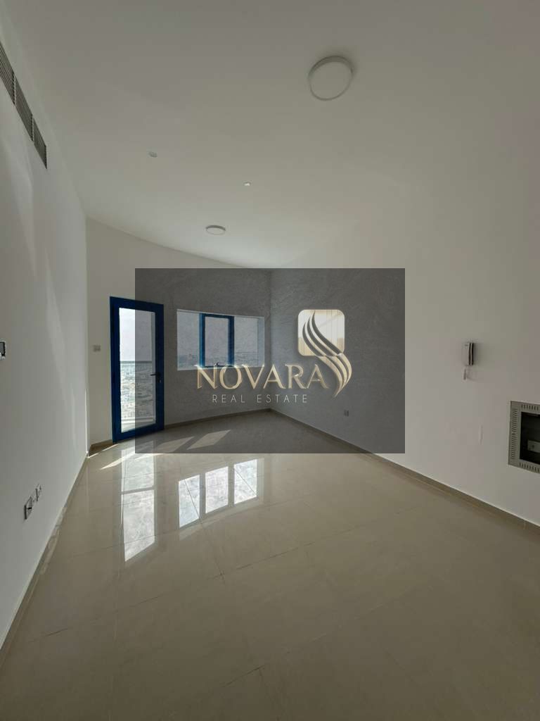 Two-bedroom apartment with a living room, first occupancy, for annual rent in Fujairah. Prime location near Century Mall, Kuwait Street, and the Corni