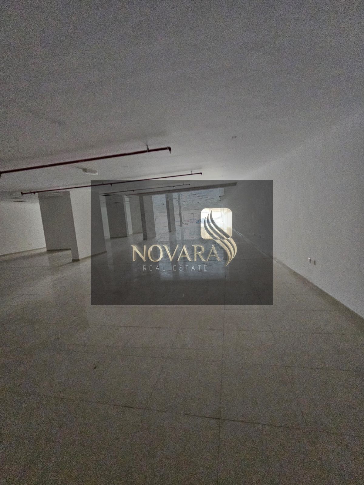 Commercial shop, 13,000 sq ft, in Al Rashidiya 1, Ajman, on a main street, prime location, ideal for investment, for rent at 800,000 AED in 4 installm