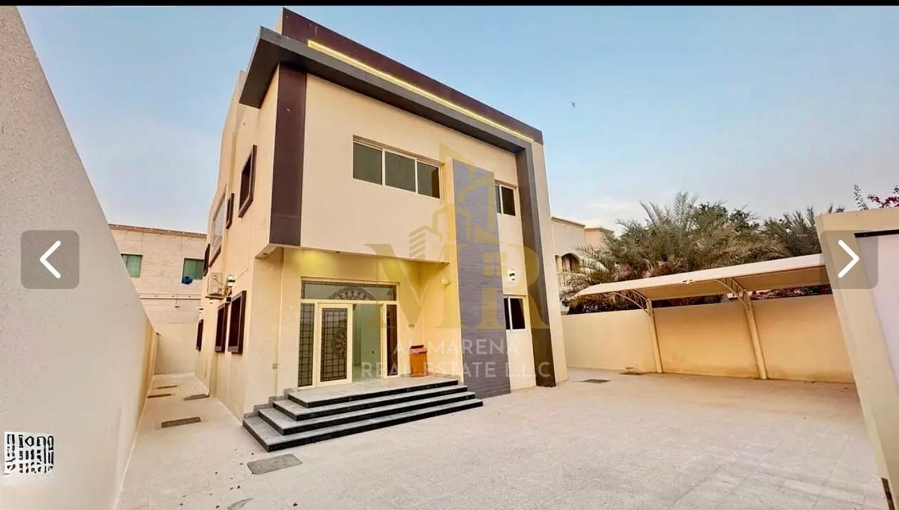 For sale in Al Rawda 1, Ajman: a two-story villa with a rooftop terrace and six bedrooms. Priced at AED 1,850,000, including electricity, water, and a