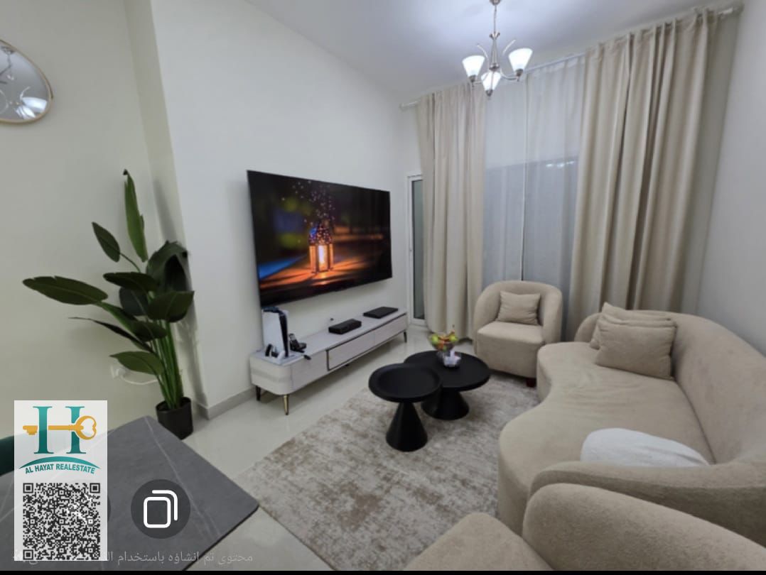 In Ajman one tower open view in garden and city 2 bedroom 3 bathroom ready to move and free hold in all international