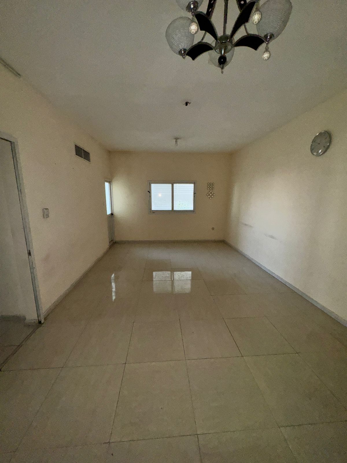 For rent in Al Qasimia – Sharjah, a spacious 2-bedroom apartment with balcony, located on a main road with all services available within the building,