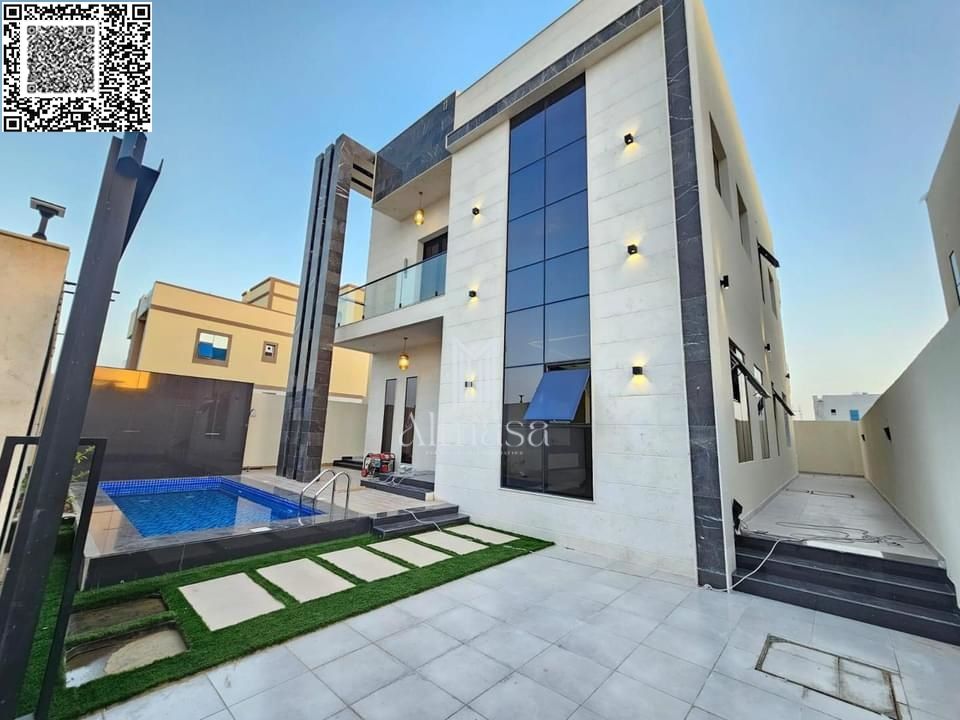 Modern luxury villa with a swimming pool for sale in Al Helio 2, Ajman – price includes registration and ownership fees – quiet location close to all