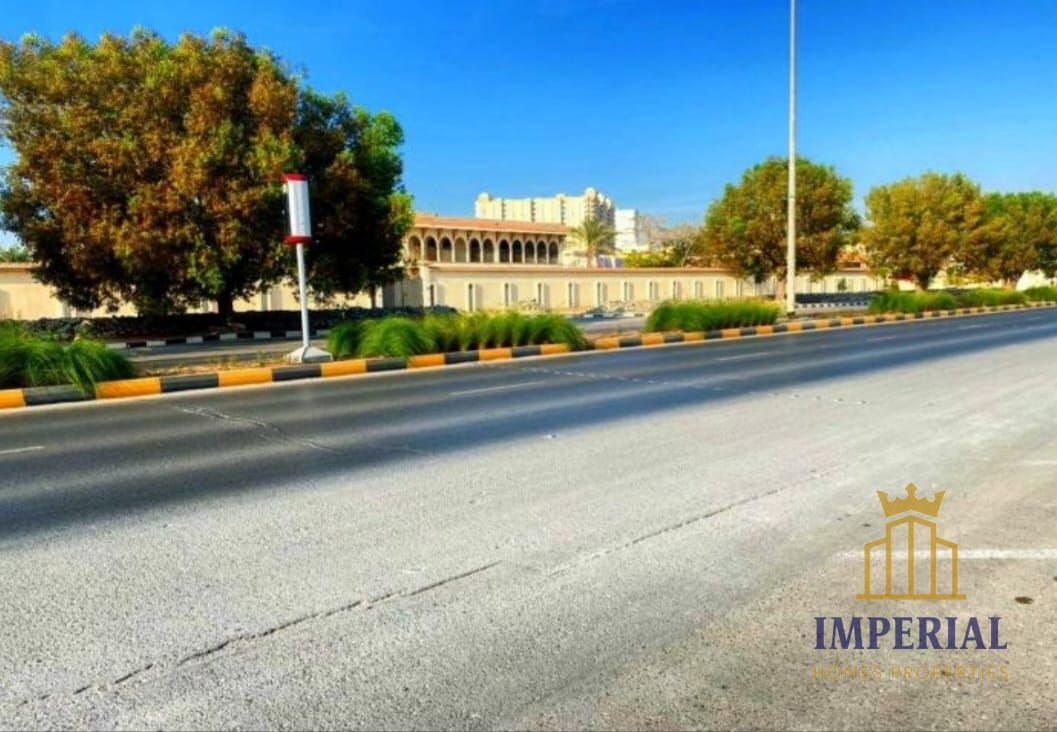Residential/commercial land for sale (G+6) opposite Ajman Markets Association on the main street in Al Rashidiya 3