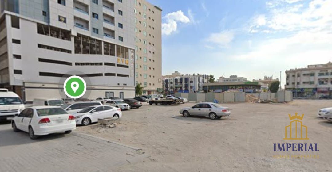 Residential/commercial land in Al Nuaimiya 1 (G+15), Ajman, second plot from Kuwait Street, freehold ownership.