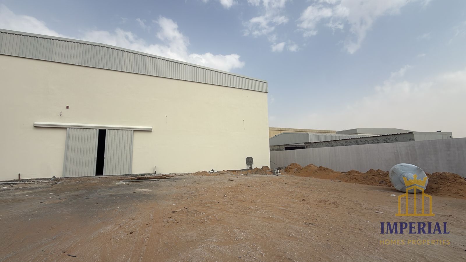 A gated plot of land (43,000 sq ft) with a 7,000 sq ft warehouse and 70 kW of electricity is available for rent.