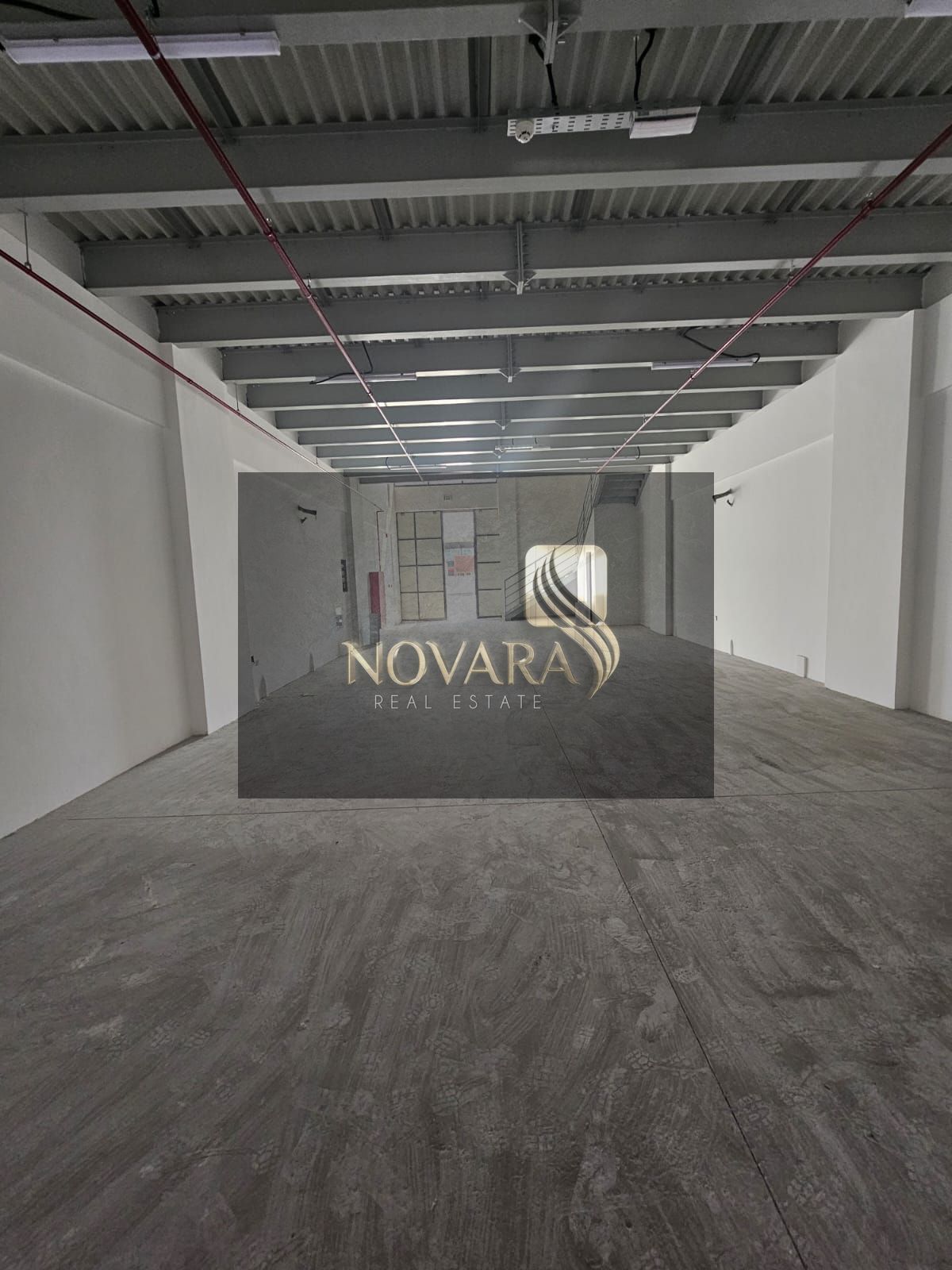 New warehouses for rent in Al Jurf Industrial Area 3 on a main street, 3000 sq ft mezzanine, 25-30 kW electricity, rent 140,000.