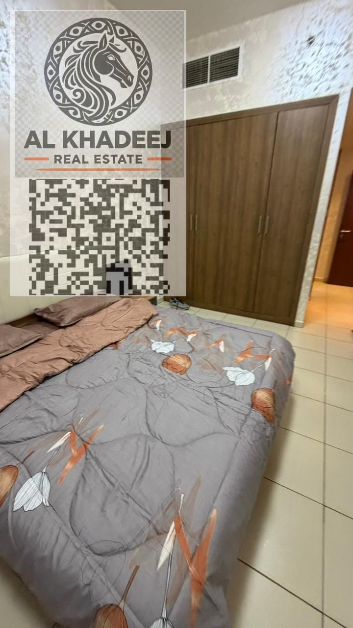 Two-bedroom apartment with a living room and balcony for sale in Ajman One Tower, with city and garden views, close to all services.