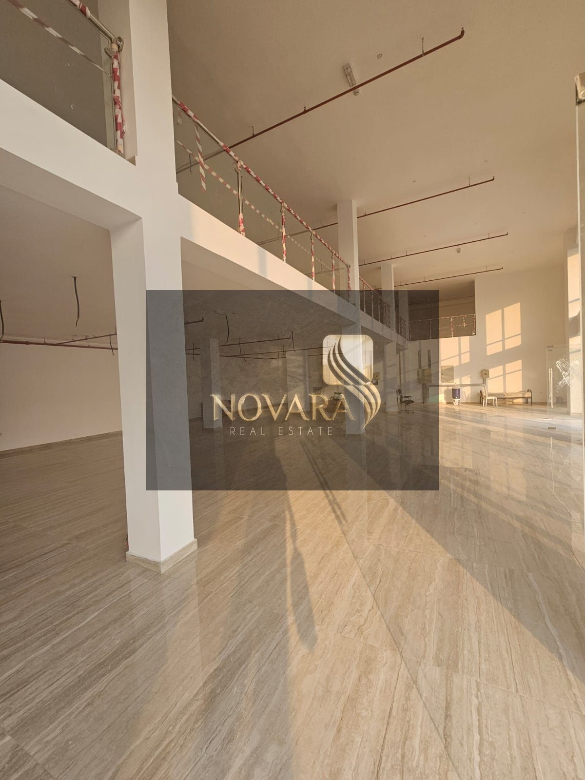 Showroom 8300 sq ft with mezzanine and external setback in Al Jurf Industrial Area 3, Ajman, 4 bathrooms, for rent 400,000 annually.