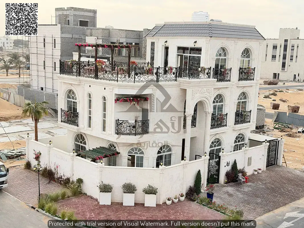 For sale: Classic corner villa with 5 bedrooms, swimming pool, and roof terrace in Al Bahia area, Ajman. Super deluxe finishing, freehold ownership, b