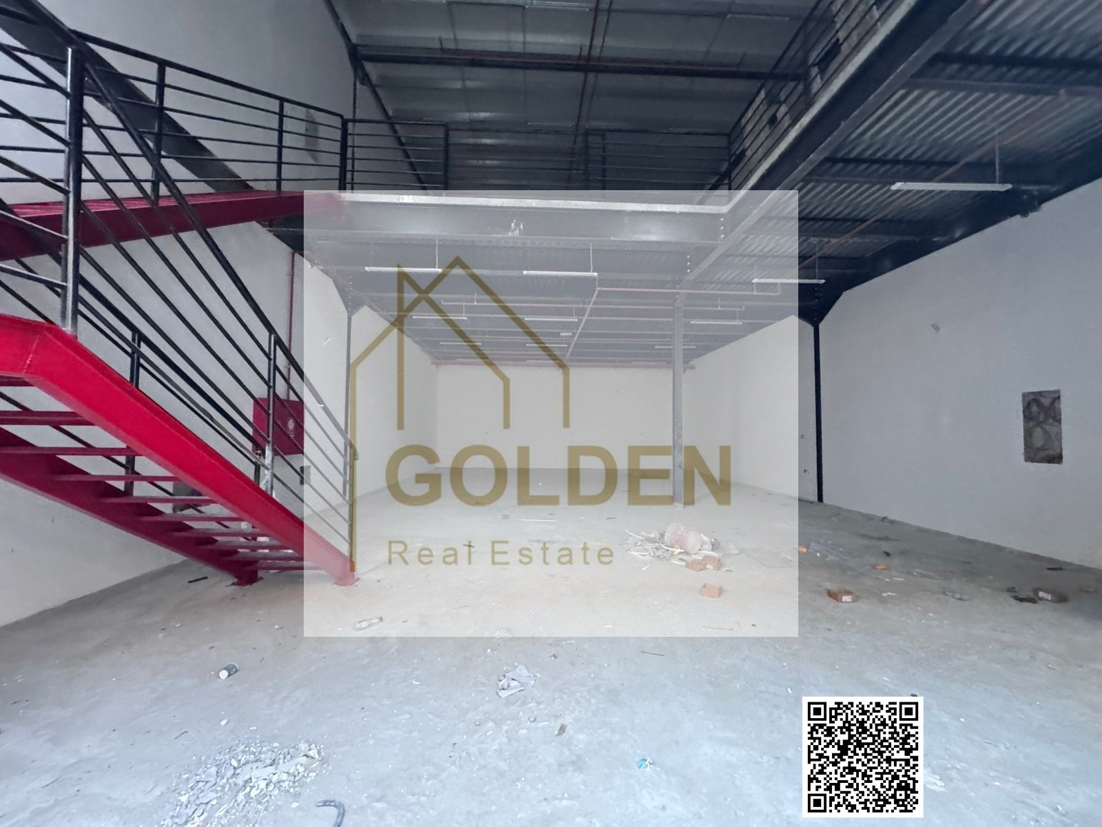 A mezzanine industrial warehouse equipped with 36kV electrical power, available for annual lease in Al Jurf Industrial Area