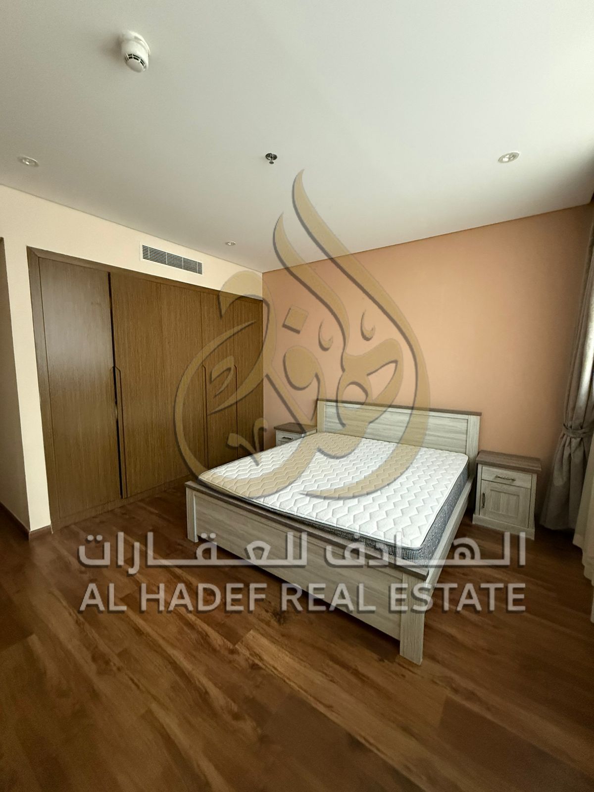 Two-bedroom apartment with a living room for annual rent, furnished, in a prime location in the Al Taawun area, with a balcony, built-in wardrobes, an