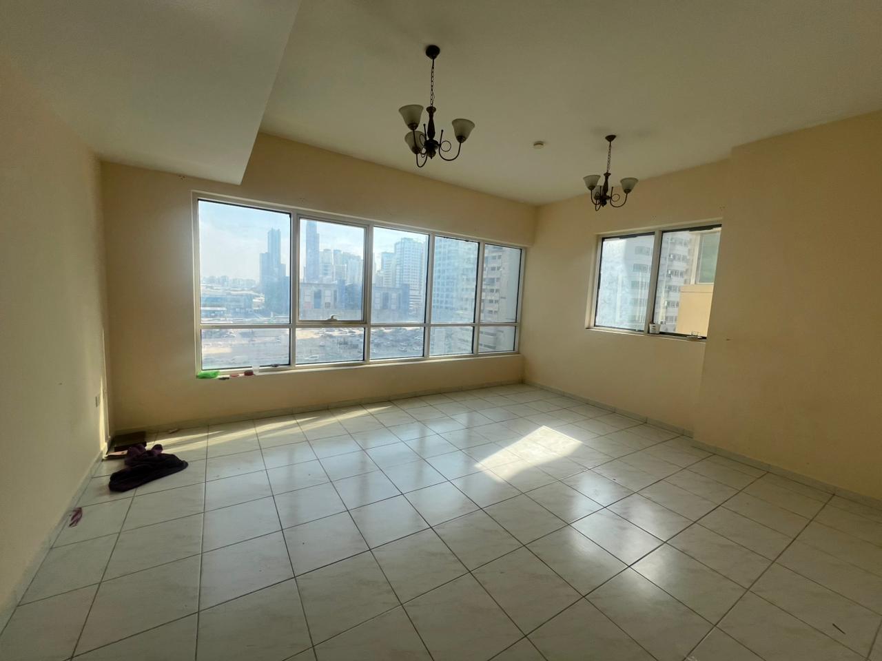 Largest three-bedroom apartment with living room in Al Taawun | Spacious area | Tiled floors | Open view | Free parking | Built-in wardrobes | Direct