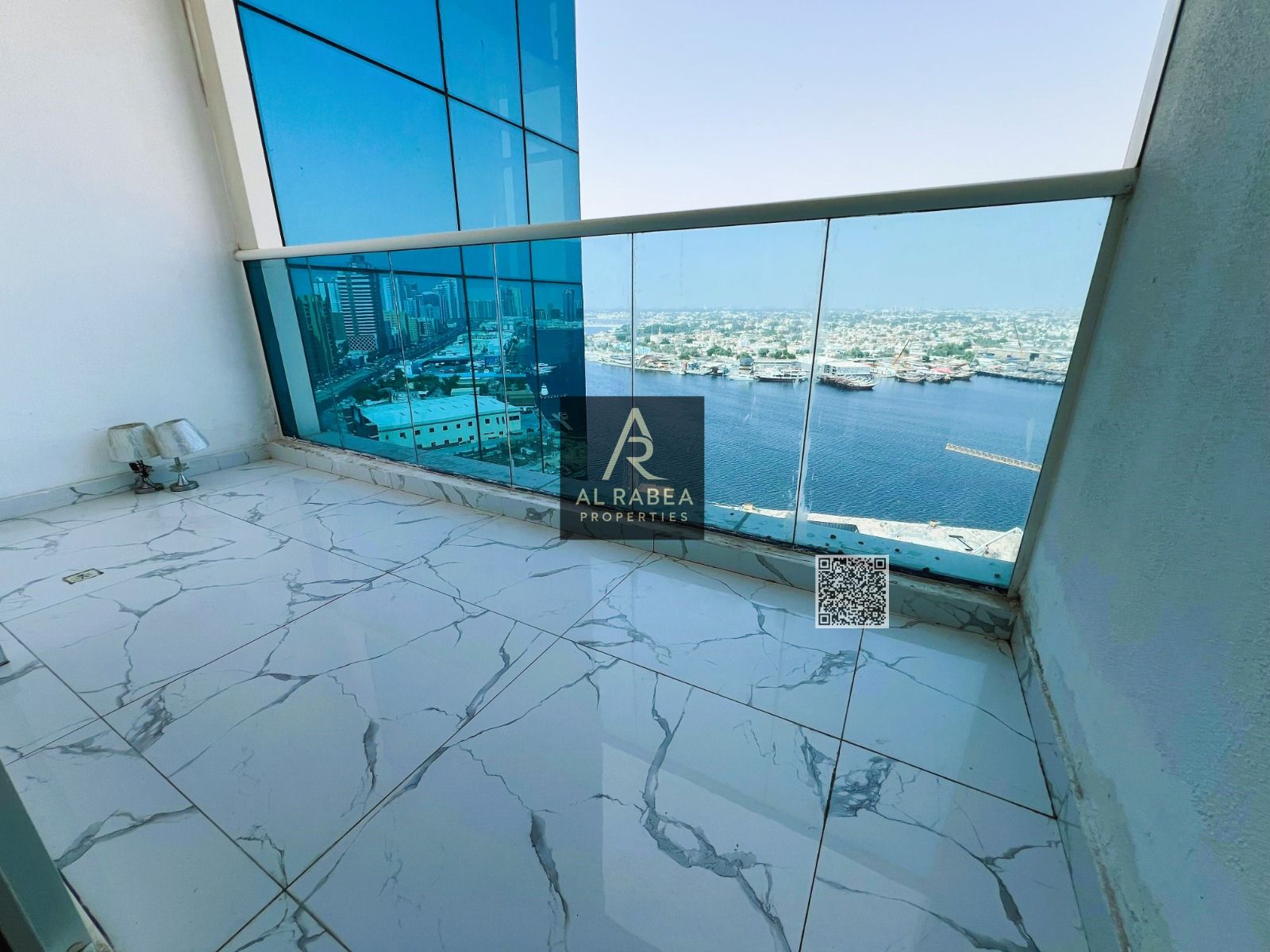 For sale: Two bedrooms and a living room with an open view of Ajman Creek. Oasis Towers, Tower 2, with built-in wardrobes.