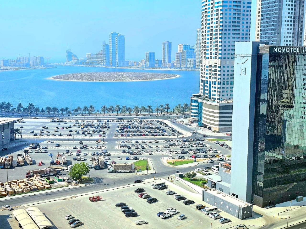 Sea View 1-Bedroom Apartment | Free Parking | Balcony | Close To Dubai Exit