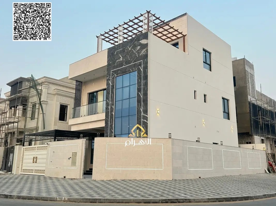 Villa for sale in Al Helio 2 - Ajman**, luxury design **freehold for all nationalities**, contact: Mohammed Marzouq - Al Ahram Real Estate Company.