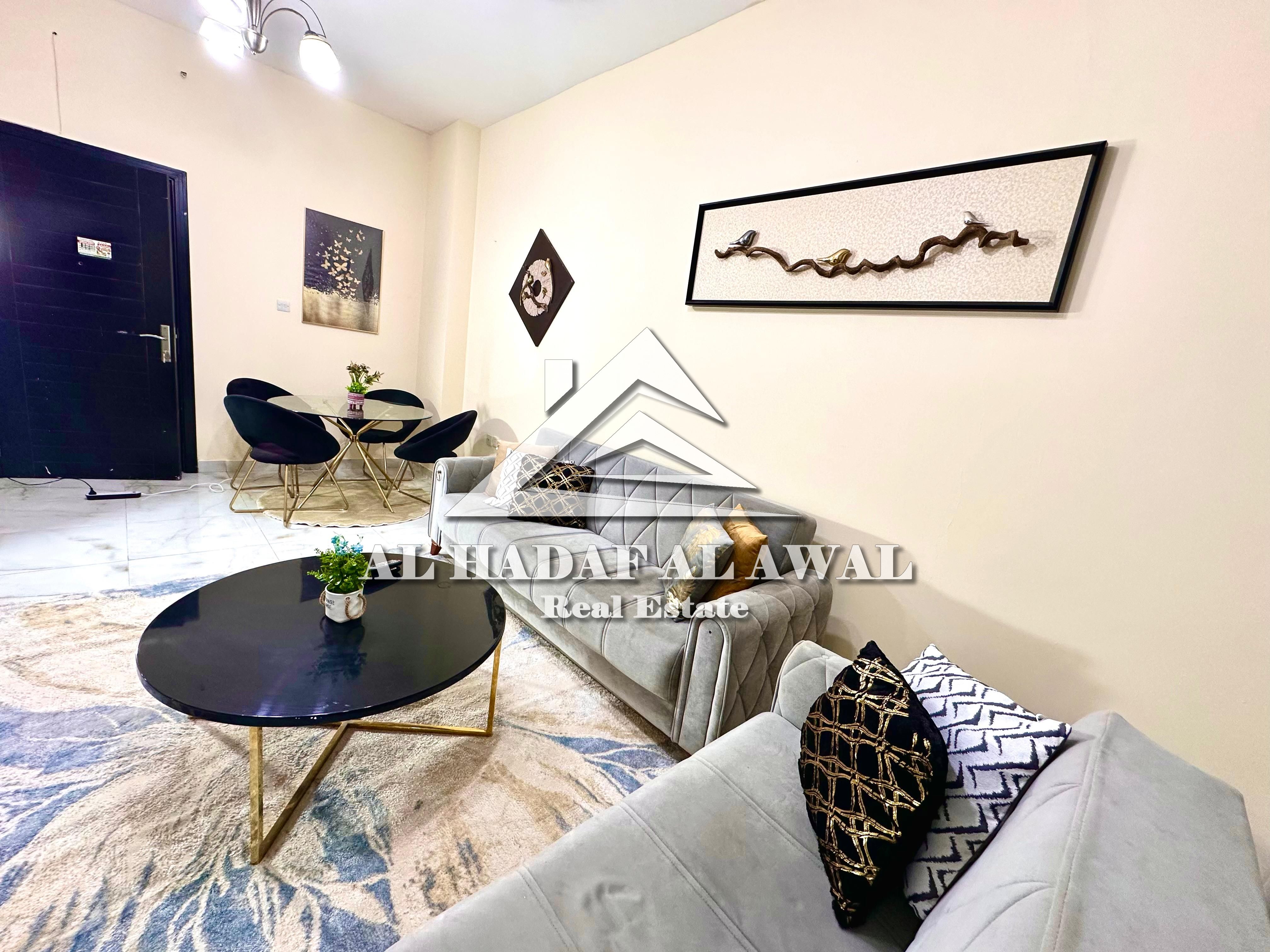 Sharjah, Al Qasba area: One bedroom and living room apartment with two bathrooms and a balcony overlooking the main street. Rent is AED 5000 including