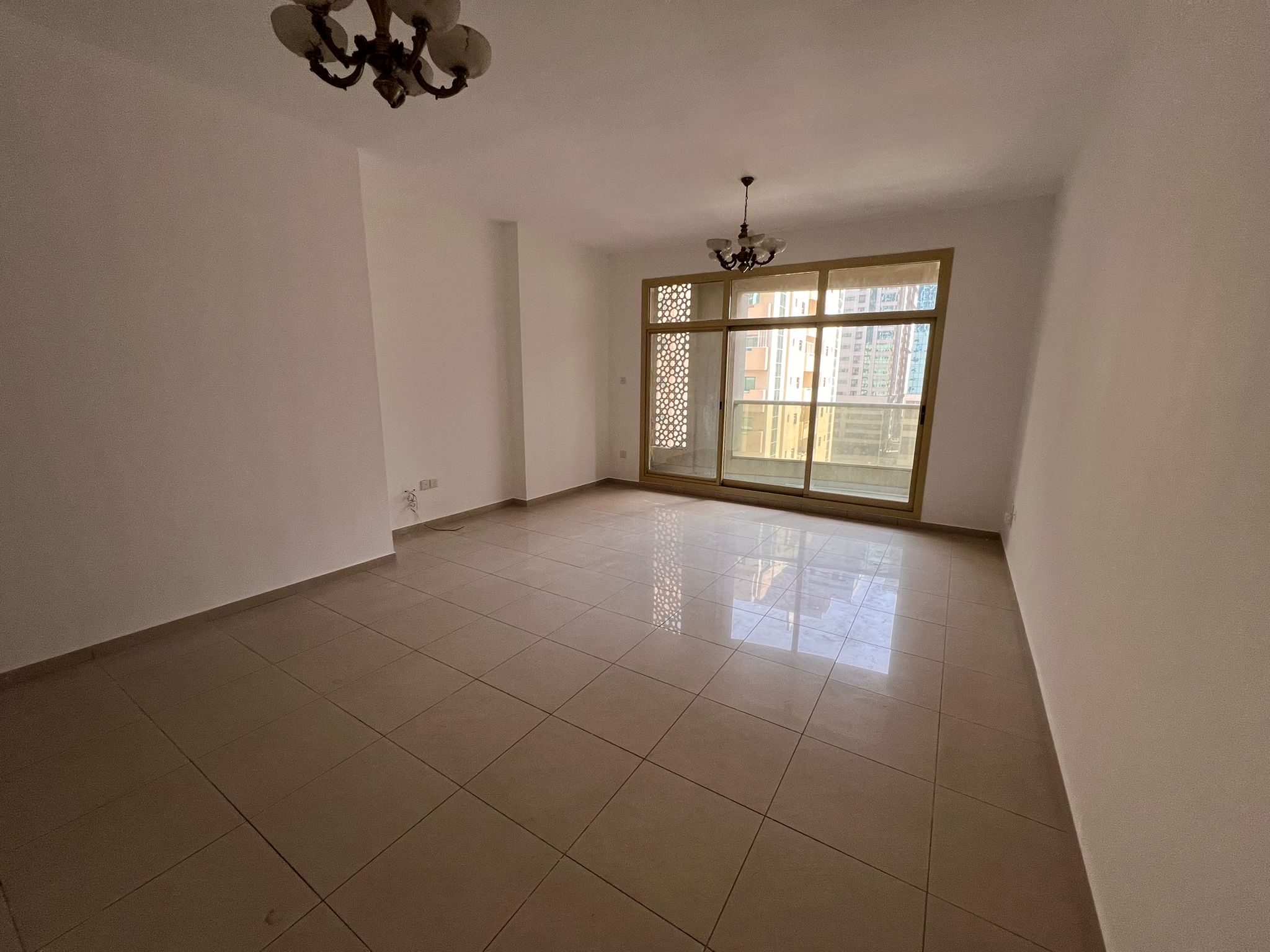 2BR apartment in Al Taawun with store room, distributor, and balcony, AED 52,800 rent, 6 cheques.