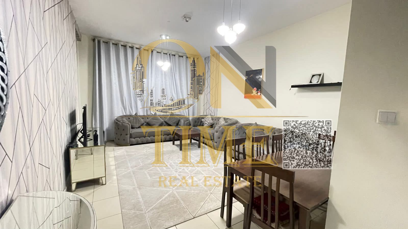 Two-bedroom apartment with a living room for monthly rent in Ajman One Towers, including bills and services.