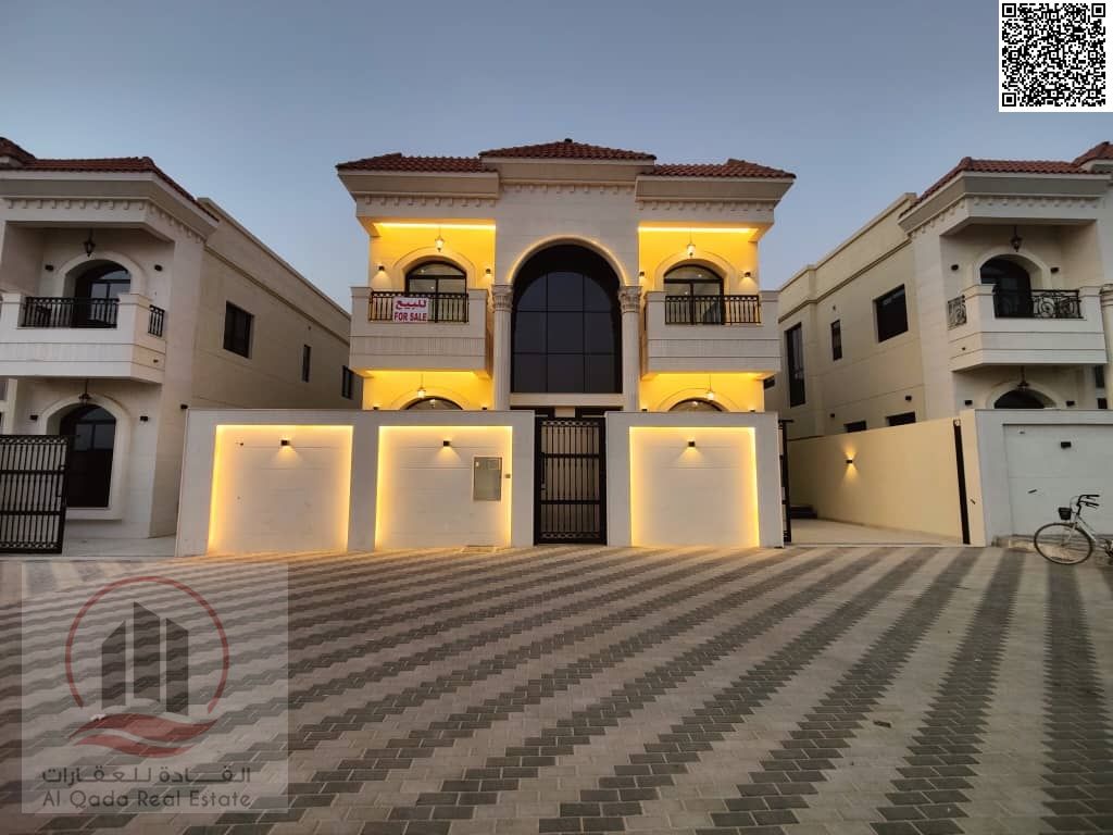 Villa for sale in Al Helio 2 area, Ajman. 5 bedrooms, living room, majlis, maid's room, and swimming pool. Elegant design in a prime location.