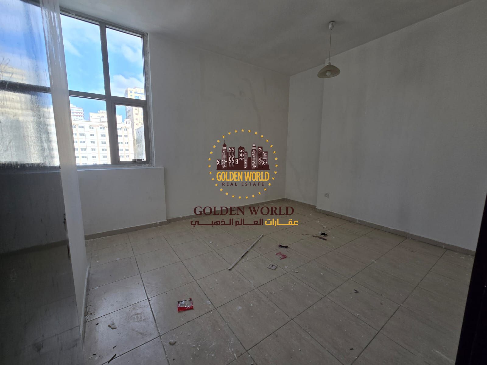 Two-bedroom apartment with a living room and balcony in Al Qasimia – Al Nad. It features two bathrooms, spacious and bright areas, an open view, large