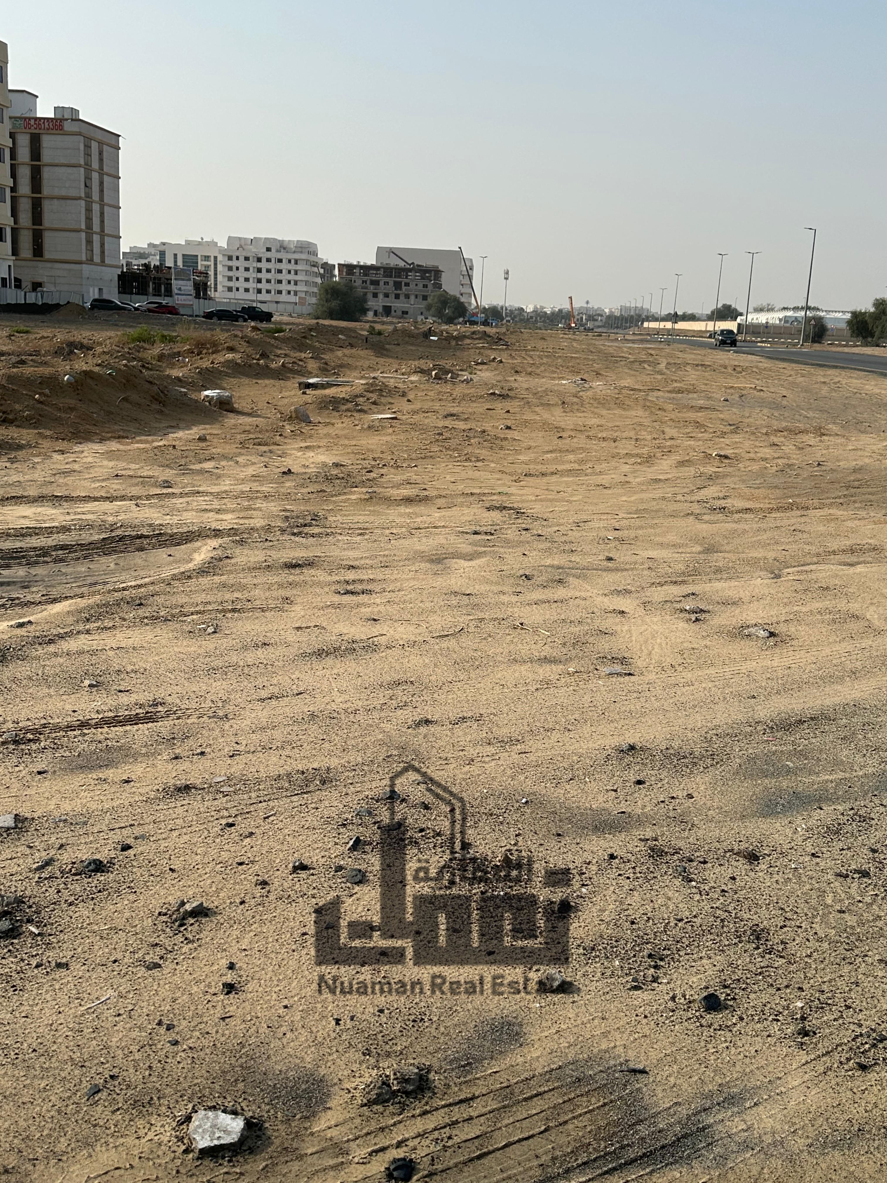 Corner plot for sale with an area of 10,000 sq. ft, strategically located on two main roads (30m & 24m),