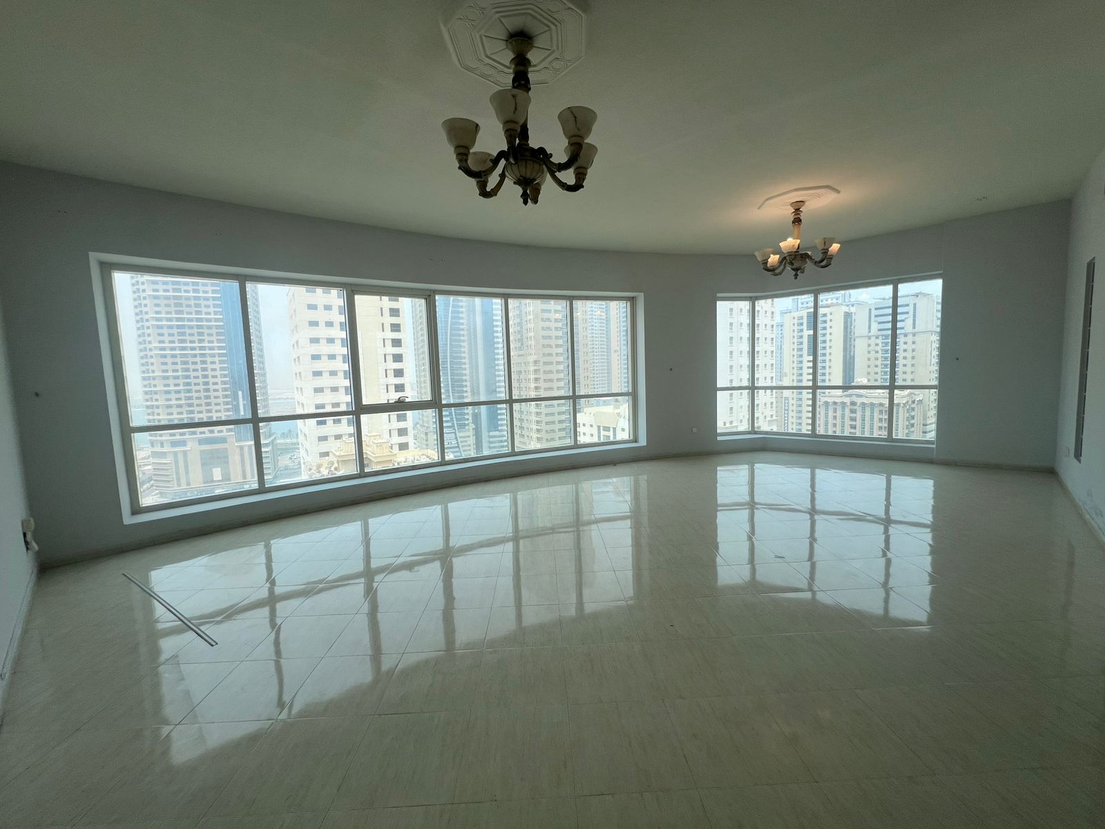 Spacious 2BR apartment with smart layout, 3 bathrooms, balcony, owner-paid AC, free gym and pool, AED 64,880 on 4 cheques.