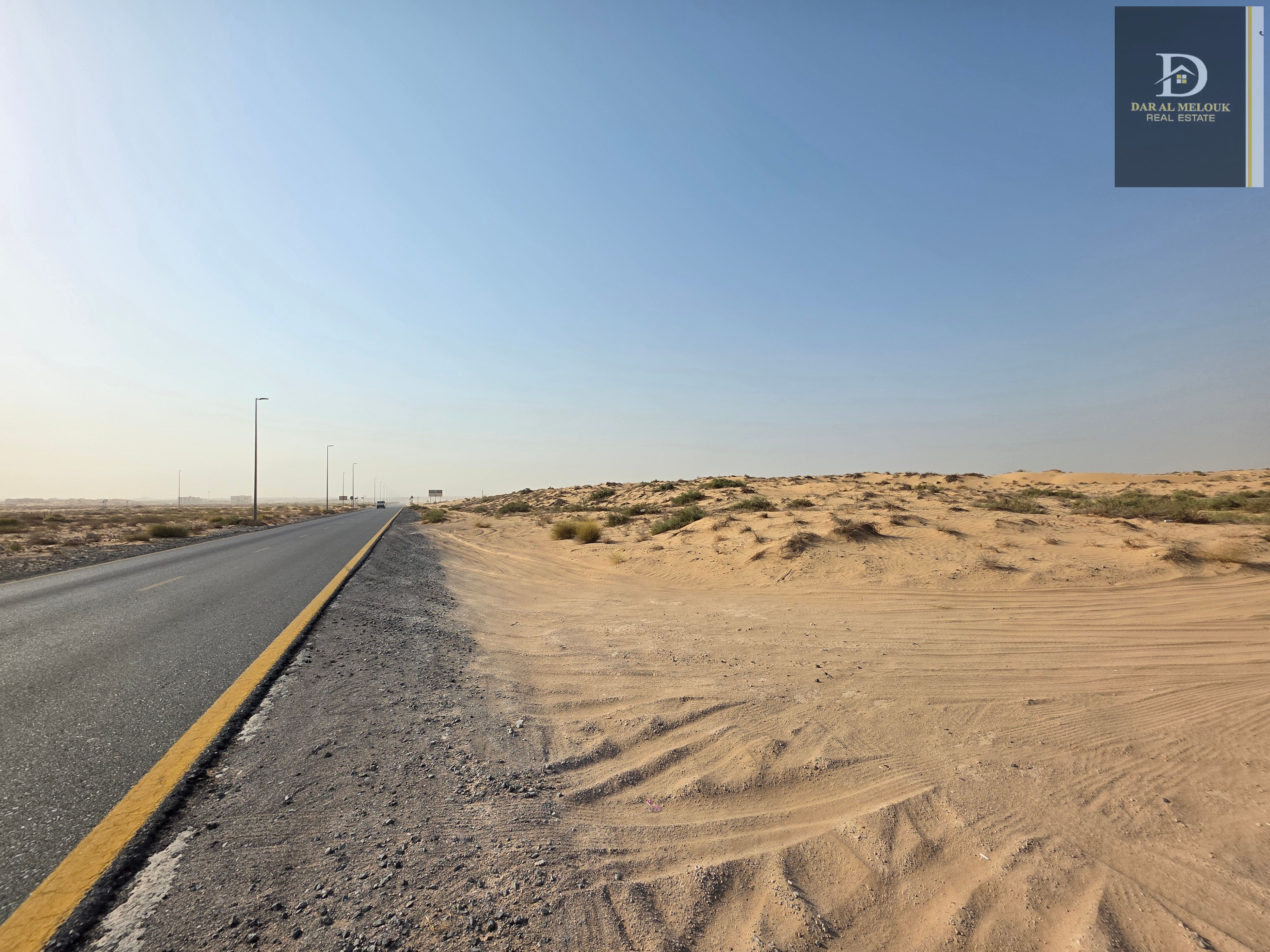 Commercial land for sale in Al Sahma, directly on Khorfakkan Street