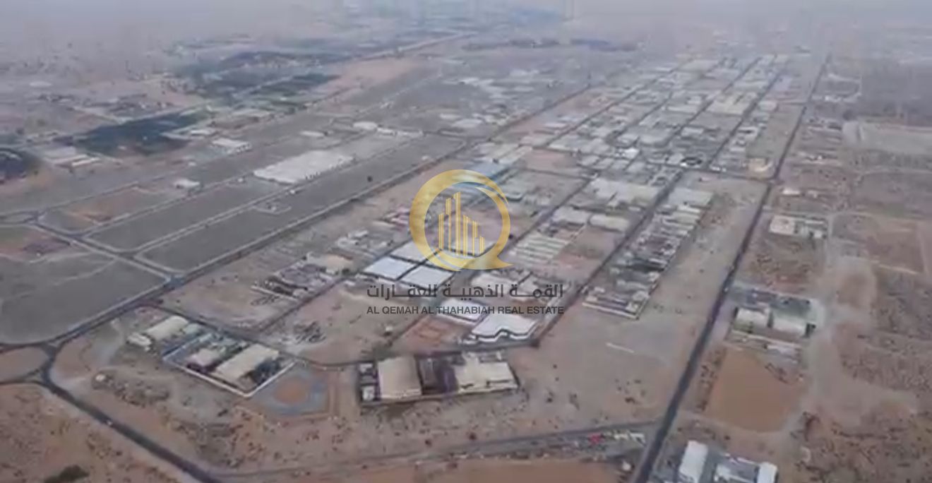 For sale: Land in the Emirates Industrial City in Al Sajaa, Block (2), Street 36, general area. Area: 52,744 sq. ft.